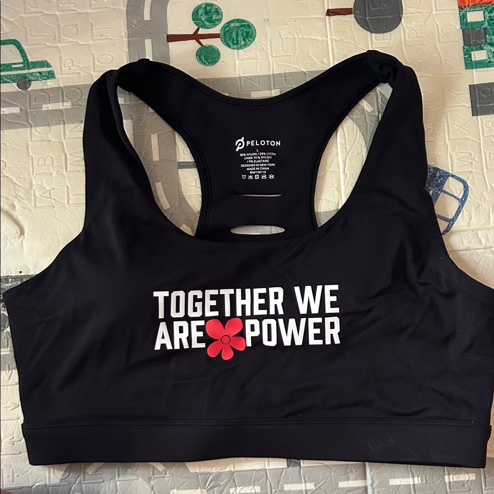 Peloton Black Sports Bra with White 'Together We Are Power' Text and Red Flower